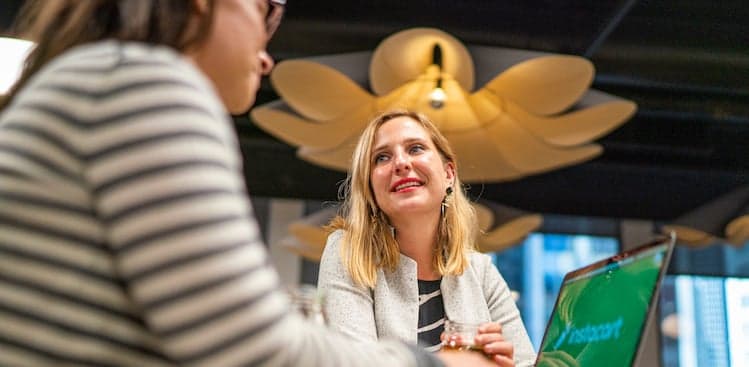 Laurentia Romaniuk of Instacart sitting with a coworker